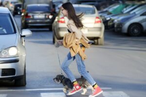 girl, child, teenager, dog, company, pet, small, leash, running, pass, pedestrians, street, cars, traffic, urban, city, teenager, animal, teenager, running, running, running, pedestrians, street, traffic, traffic, traffic, traffic, traffic